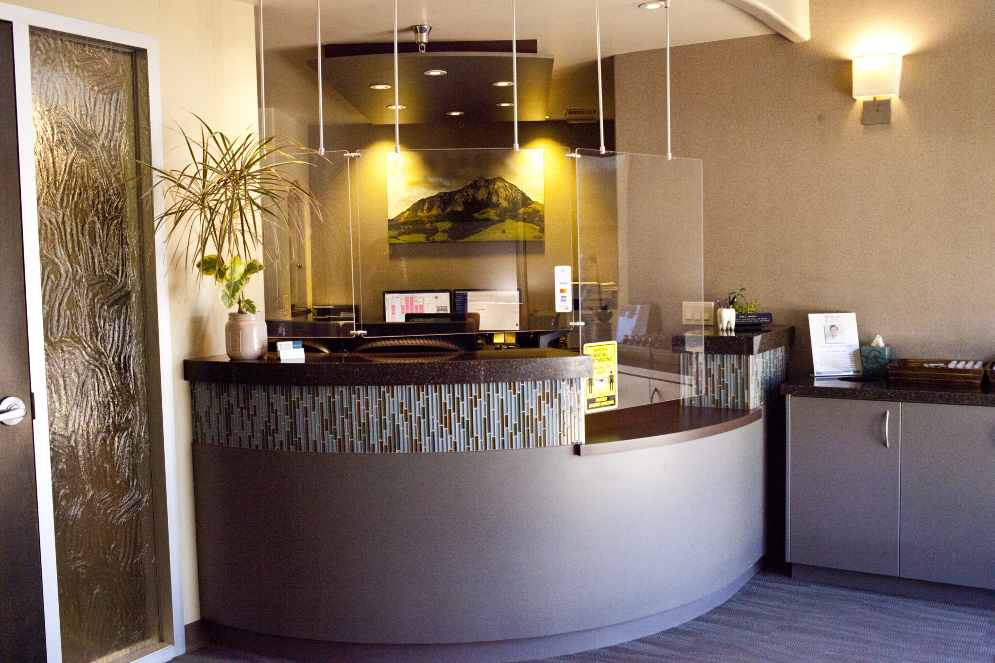 An exterior photo of "Broad Smiles" dental office.