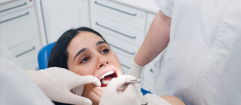 Patient receiving a dental exam at Broad St Smiles in San Luis Obispo, CA.