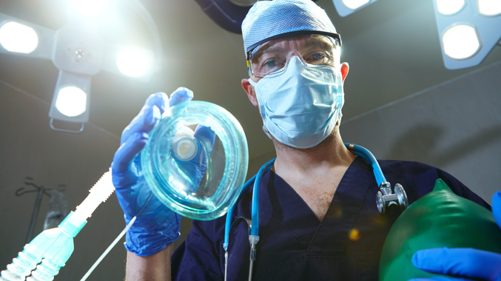 Dental professional preparing sedation equipment for patient comfort at Broad St Smiles in San Luis Obispo, CA.