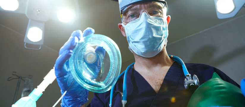 Dental professional preparing sedation equipment for patient comfort at Broad St Smiles in San Luis Obispo, CA.