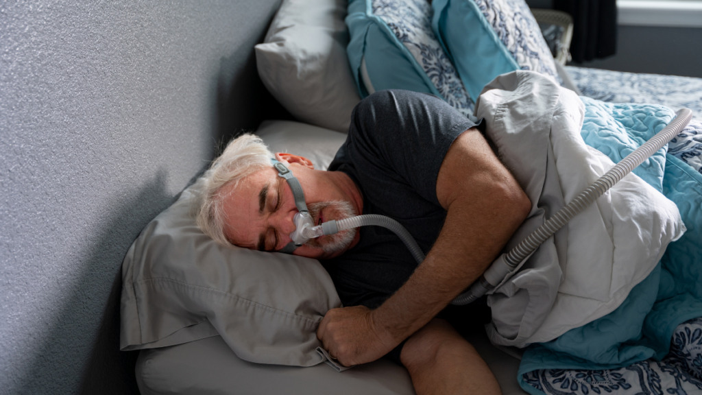 Patient using a sleep apnea breathing device at home, related to care provided by Broad St Smiles in San Luis Obispo, CA.