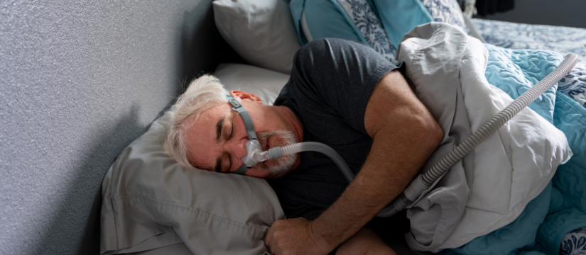 Patient using a sleep apnea breathing device at home, related to care provided by Broad St Smiles in San Luis Obispo, CA.